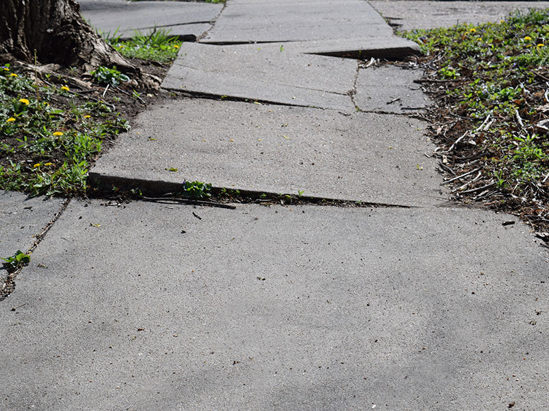 Broken sidewalk badly in need of maintenance