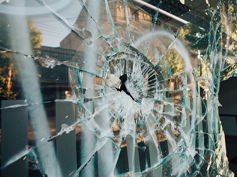 Smashed window showing property damage
