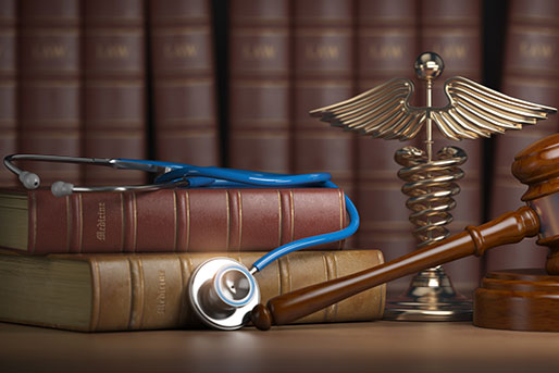 Gavel and stethoscope with books